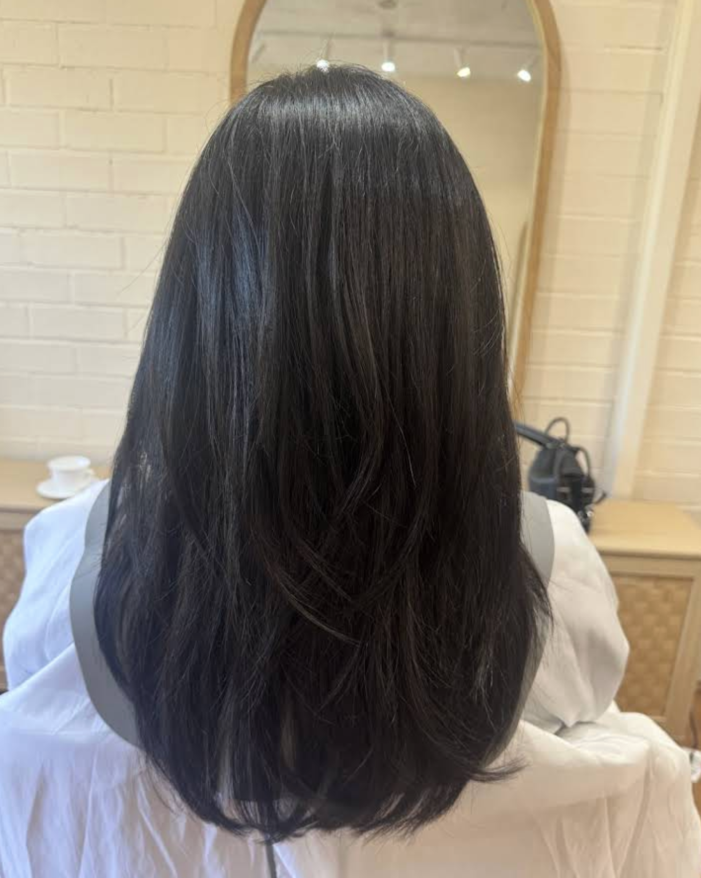 Polished long hairstyle by HI SIX Hair Studio